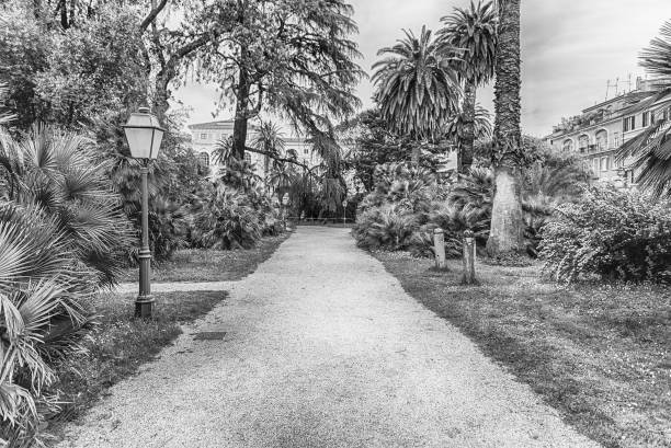 Scenic trail surrounded by nature inside a public park in the city centre of Rome, Italy
