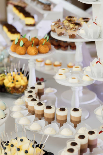 istock Beautifully decorated table with sweets and desserts for holiday guests 1368771051