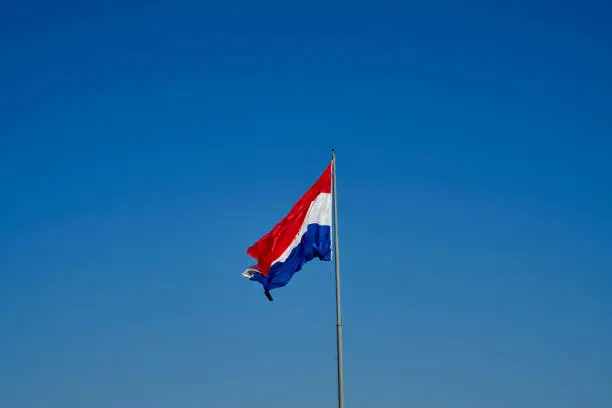 Photo of Giant flag of Paraguay waving in the wind at the cerro cora national park, South America