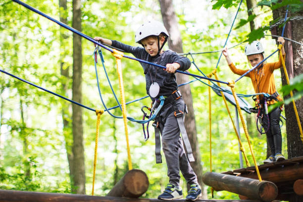 istock Children in zip line park 1368780388