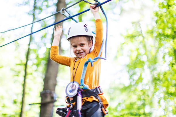 istock Little girl in zip line park 1368780553