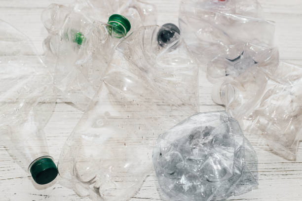 istock Plastic bottles from sweet water with colorful caps, ecology concept 1368782106