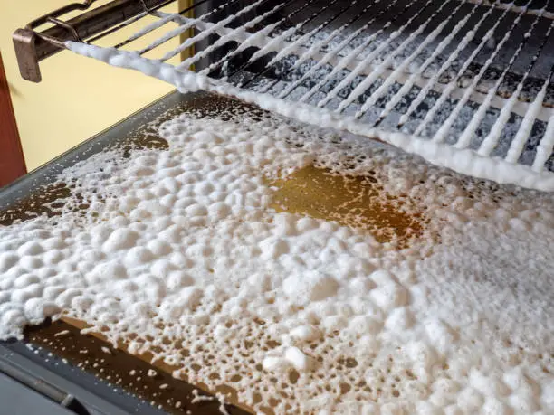 Photo of Foam from the cleaning agent for the oven cleaning