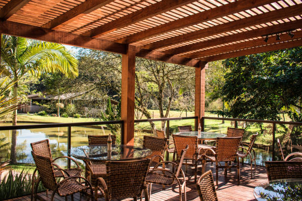 istock pergola and deck with tables restaurant garden with a pond background 1368784140