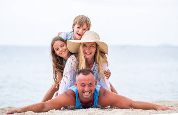 istock Family posing on the beach 1368784615
