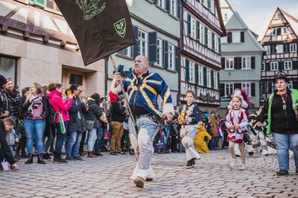 Swabian Fasnet - Colorful carnival Tuebingen, Germany - February 09, 2020: Swabian Fasnet - Colorful carnival procession on the street of the old town of Tübingen - Swabian-Alemannic Fasnet is a pagan affair with old traditions fasnacht festival stock pictures, royalty-free photos & images