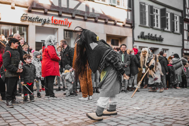 Swabian Fasnet - Colorful carnival Tuebingen, Germany - February 09, 2020: Swabian Fasnet - Colorful carnival procession on the street of the old town of Tübingen - Swabian-Alemannic Fasnet is a pagan affair with old traditions fasnacht festival stock pictures, royalty-free photos & images