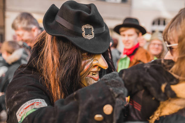 Swabian Fasnet - Colorful carnival Tuebingen, Germany - February 09, 2020: Swabian Fasnet - Colorful carnival procession on the street of the old town of Tübingen - Swabian-Alemannic Fasnet is a pagan affair with old traditions fasnacht festival stock pictures, royalty-free photos & images