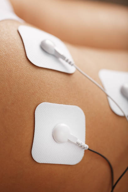 istock Muscle stimulator with electrodes, the massager on the buttocks and legs. 1368787276