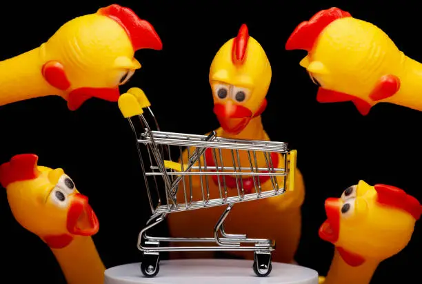 image of trolley rubber chicken dark background