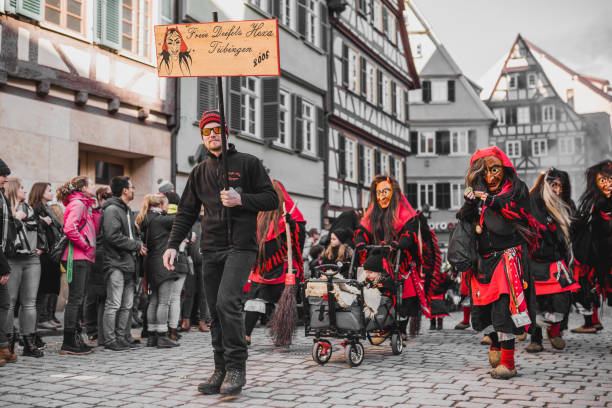 Swabian Fasnet - Colorful carnival Tuebingen, Germany - February 09, 2020: Swabian Fasnet - Colorful carnival procession on the street of the old town of Tübingen - Swabian-Alemannic Fasnet is a pagan affair with old traditions fasnacht festival stock pictures, royalty-free photos & images