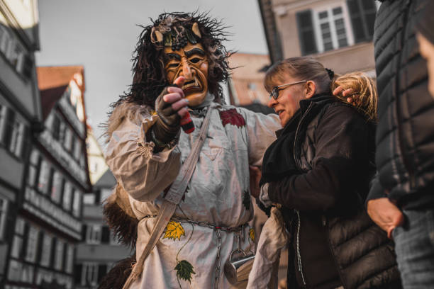 Swabian Fasnet - Colorful carnival Tuebingen, Germany - February 09, 2020: Swabian Fasnet - Colorful carnival procession on the street of the old town of Tübingen - Swabian-Alemannic Fasnet is a pagan affair with old traditions fasnacht festival stock pictures, royalty-free photos & images