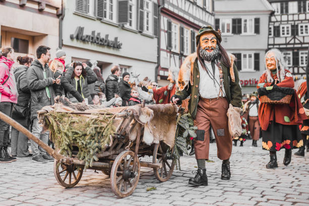 Swabian Fasnet - Colorful carnival Tuebingen, Germany - February 09, 2020: Swabian Fasnet - Colorful carnival procession on the street of the old town of Tübingen - Swabian-Alemannic Fasnet is a pagan affair with old traditions fasnacht festival stock pictures, royalty-free photos & images