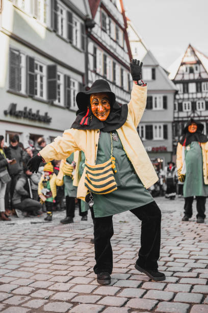 Swabian Fasnet - Colorful carnival Tuebingen, Germany - February 09, 2020: Swabian Fasnet - Colorful carnival procession on the street of the old town of Tübingen - Swabian-Alemannic Fasnet is a pagan affair with old traditions fasnacht festival stock pictures, royalty-free photos & images