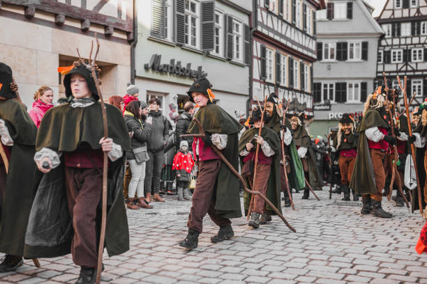 Swabian Fasnet - Colorful carnival Tuebingen, Germany - February 09, 2020: Swabian Fasnet - Colorful carnival procession on the street of the old town of Tübingen - Swabian-Alemannic Fasnet is a pagan affair with old traditions fasnacht festival stock pictures, royalty-free photos & images