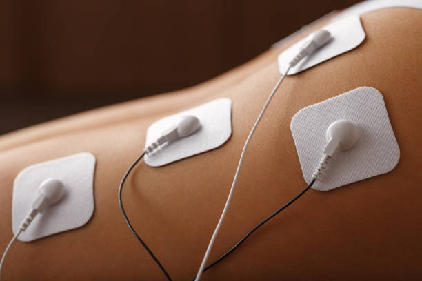 istock Muscle stimulator with electrodes, the massager on the buttocks and legs. 1368787733