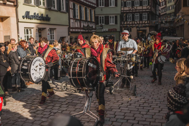 Swabian Fasnet - Colorful carnival Tuebingen, Germany - February 09, 2020: Swabian Fasnet - Colorful carnival procession on the street of the old town of Tübingen - Swabian-Alemannic Fasnet is a pagan affair with old traditions fasnacht festival stock pictures, royalty-free photos & images