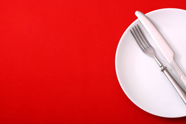 istock Seasonal red table, cutlery and white plate. 1368789467