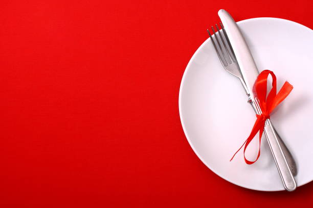 istock Seasonal red table with cutlery. 1368789594