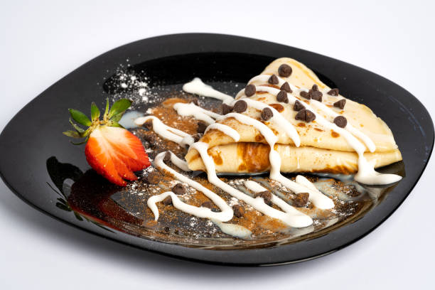 istock Chocolate pancakes placed on a black plate with ice sugar and chocolate coating 1368789617