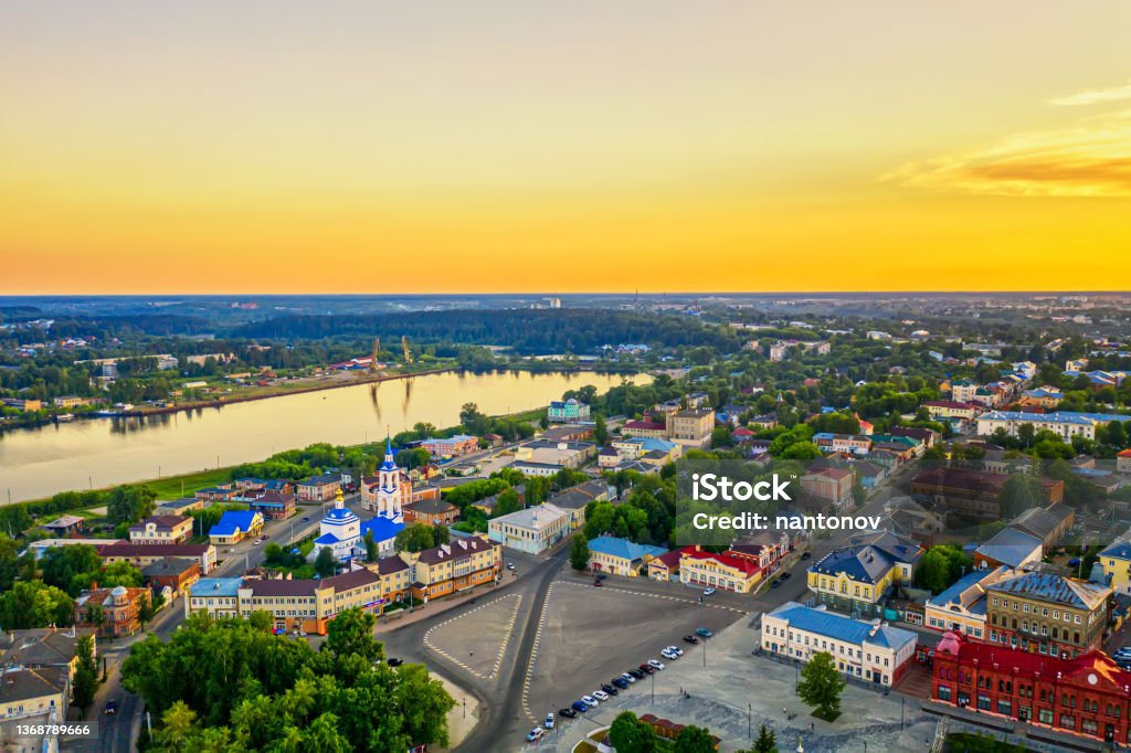 Aerial drone view of Kineshma ancient city with Volga river in Ivanovo region, Russia. Summer sunny day sunset Aerial drone view of Kineshma ancient city with Volga river in Ivanovo region, Russia. Summer sunny day sunset. Ivanovo - Russia Stock Photo