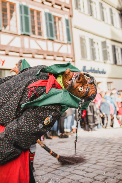 Swabian Fasnet - Colorful carnival Tuebingen, Germany - February 09, 2020: Swabian Fasnet - Colorful carnival procession on the street of the old town of Tübingen - Swabian-Alemannic Fasnet is a pagan affair with old traditions fasnacht festival stock pictures, royalty-free photos & images