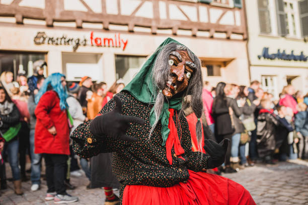 Swabian Fasnet - Colorful carnival Tuebingen, Germany - February 09, 2020: Swabian Fasnet - Colorful carnival procession on the street of the old town of Tübingen - Swabian-Alemannic Fasnet is a pagan affair with old traditions fasnacht festival stock pictures, royalty-free photos & images