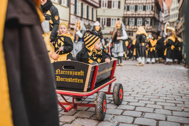 Swabian Fasnet - Colorful carnival Tuebingen, Germany - February 09, 2020: Swabian Fasnet - Colorful carnival procession on the street of the old town of Tübingen - Swabian-Alemannic Fasnet is a pagan affair with old traditions fasnacht festival stock pictures, royalty-free photos & images