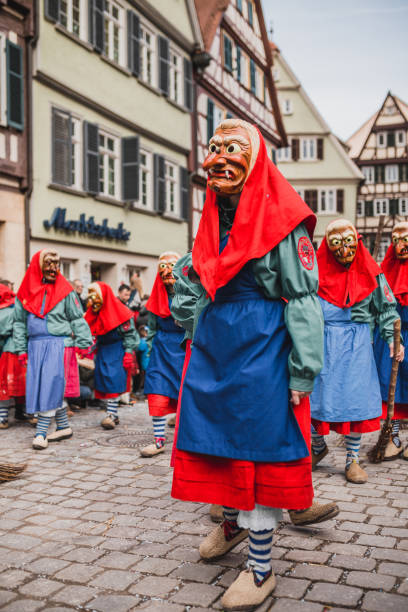 Swabian Fasnet - Colorful carnival Tuebingen, Germany - February 09, 2020: Swabian Fasnet - Colorful carnival procession on the street of the old town of Tübingen - Swabian-Alemannic Fasnet is a pagan affair with old traditions fasnacht festival stock pictures, royalty-free photos & images