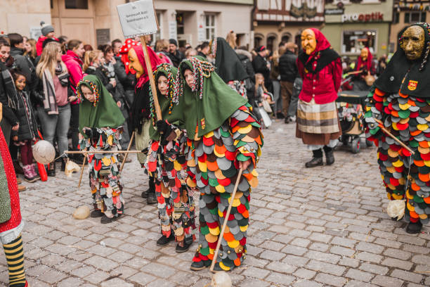 Swabian Fasnet - Colorful carnival Tuebingen, Germany - February 09, 2020: Swabian Fasnet - Colorful carnival procession on the street of the old town of Tübingen - Swabian-Alemannic Fasnet is a pagan affair with old traditions fasnacht festival stock pictures, royalty-free photos & images