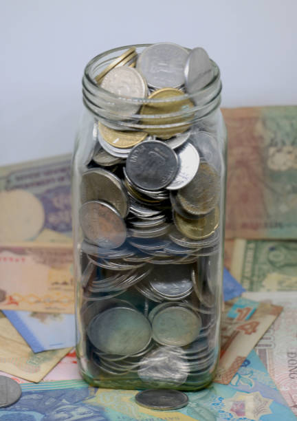 istock glass jar full of coins on isolated background 1368791045