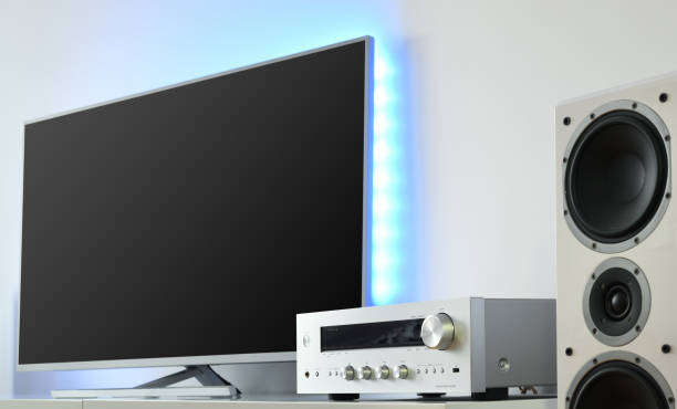 istock Large LED TV with backlight and audio receiver in a modern apartment. 1368792001