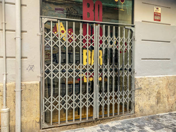 Valencia, Spain - October 10, 2021: Closed fence of bar in the city downtown. Bars in this part of the city open usually during the afternoon and night as it is mostly a touristic area