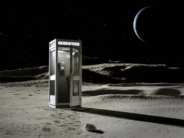 An old telephone booth on the lunar surface against the backdrop of a mountain, starry sky and earth. 3d rendering.