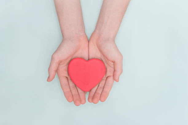 istock Valentine's Day, colorful gingerbread in the palms. 1368796182