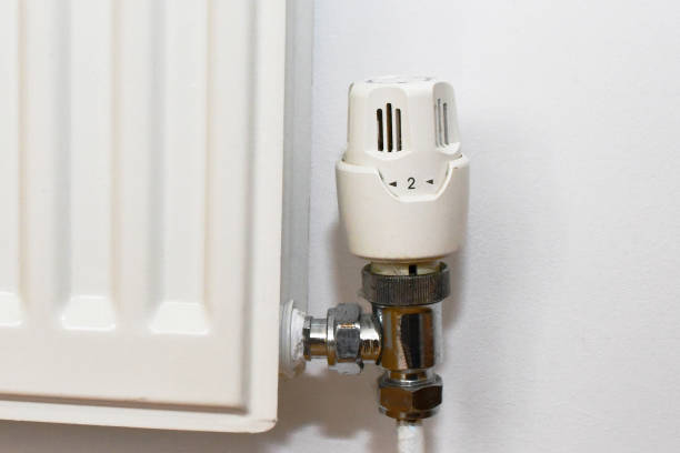 istock Thermostat control valve on a domestic central heating radiator 1368798937