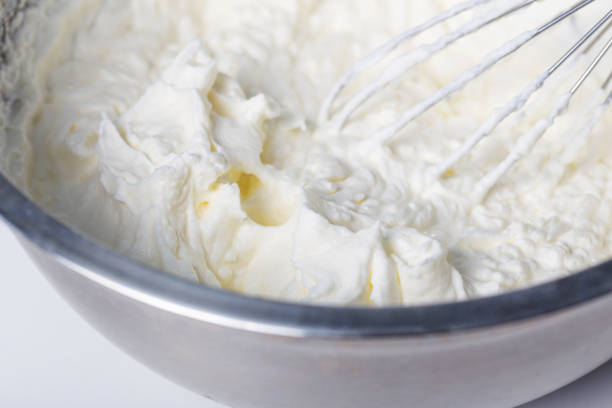white whipped cream in metal bowl