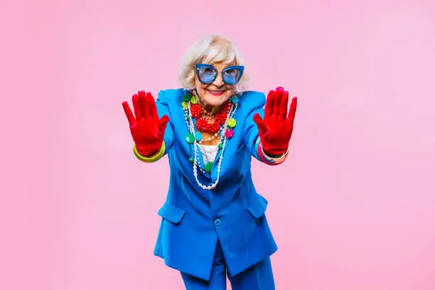 Photo of Cool and stylish senior old woman with fashionable clothes