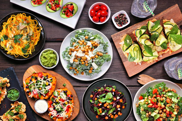 istock Healthy plant based, low carb diet table scene. Overhead view on dark wood. 1368802223