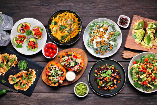 istock Healthy plant based, low carb diet table scene. Above view on dark wood. 1368802224