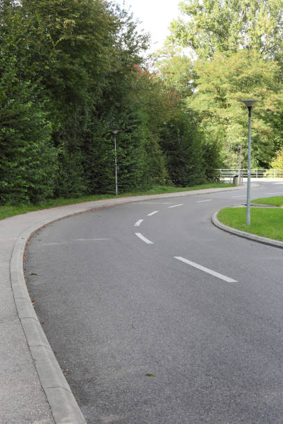 istock Asphalt road in the park turning right 1368802374