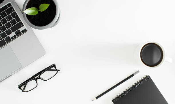 istock A white office desk with a computer keyboard and other stationery. 1368803396