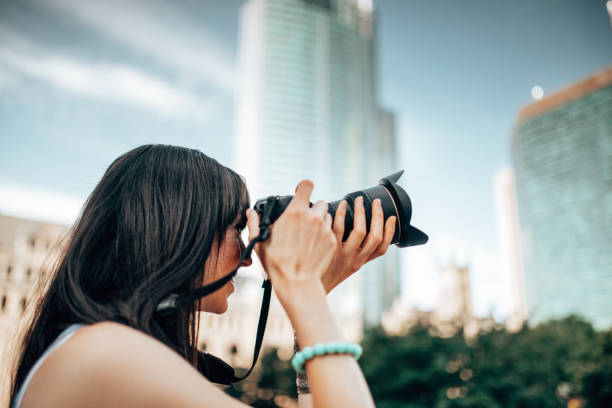 istock beautiful photographer with camera 1368803492