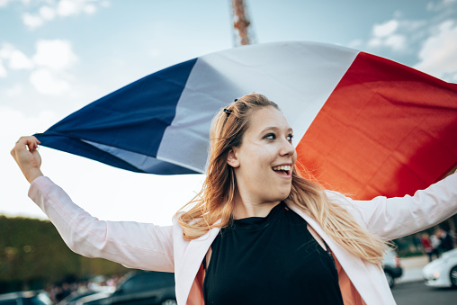 happiness tourist with french flag in paris