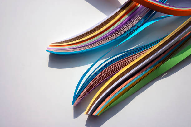 istock Colorful curved papers on white background. 1368805754