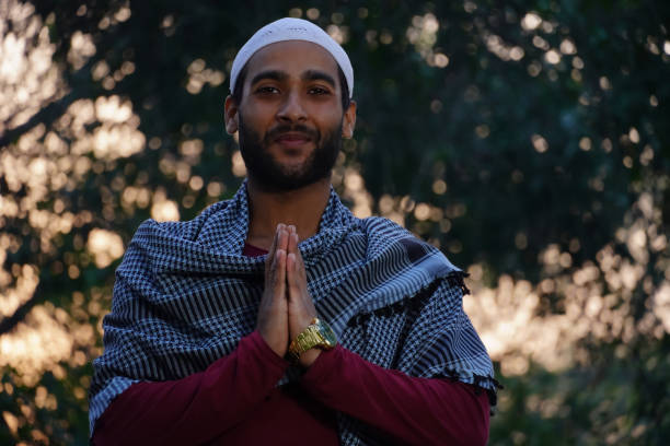 istock muslim man doing namastay 1368805761