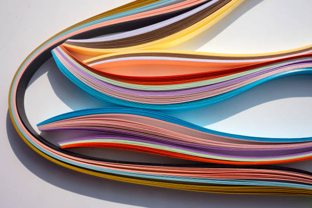 istock Colorful curved papers on white background. 1368805823