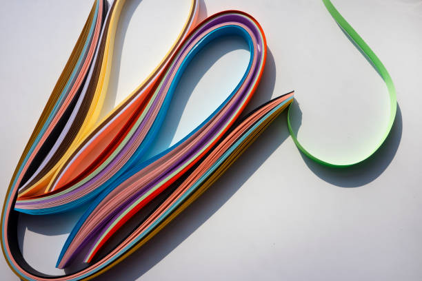 istock Colorful curved papers on white background. 1368805881