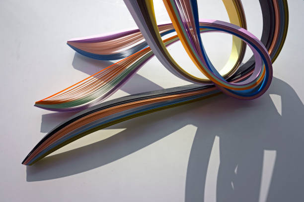 istock Colorful curved papers on white background. 1368805971