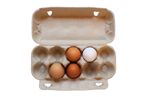 Cardboard container with eggs. Close-up. View from above. Isolated object on white background. Isolate.